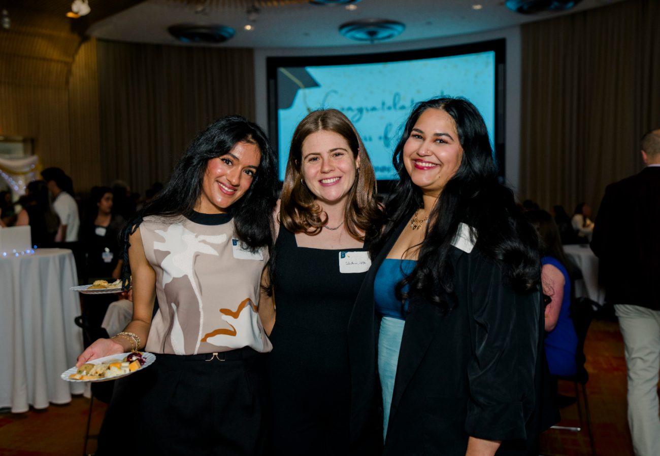 Mahima Mehta, Julia Prescott, and Narayani Ballambat smiling in group photo