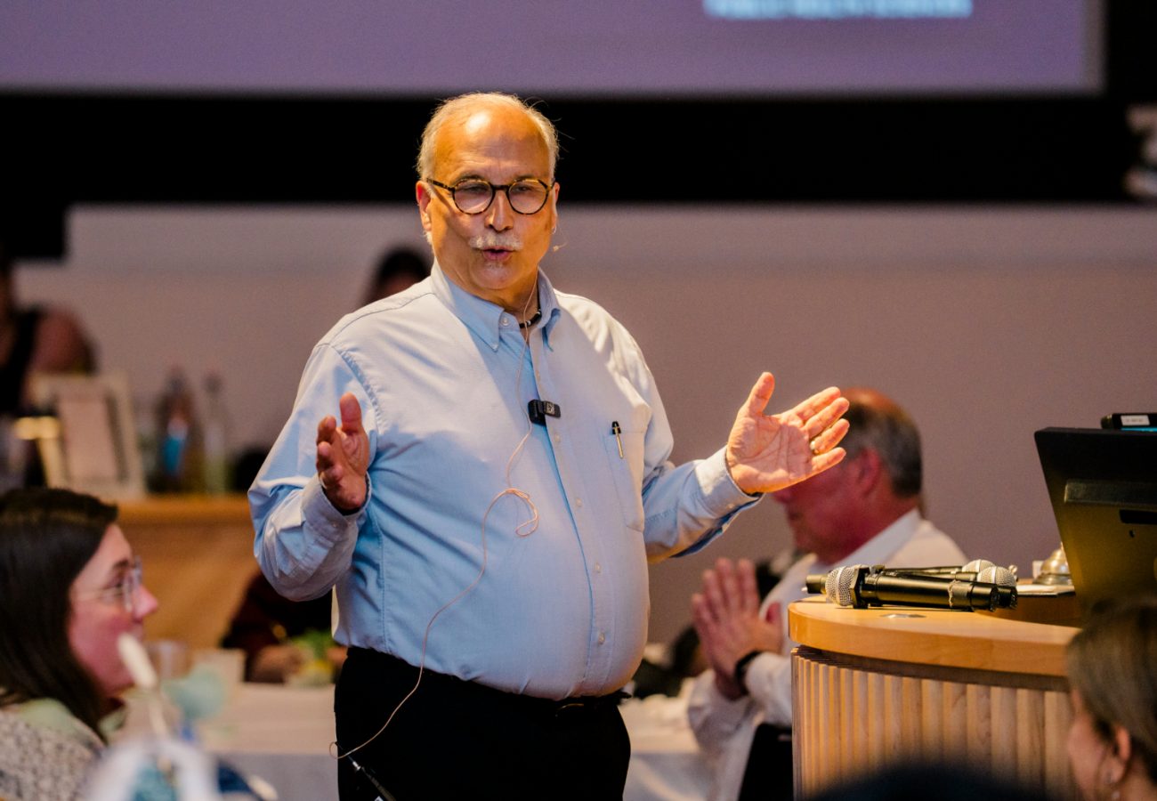 David Gregorio stands with hands apart and looks at the ground