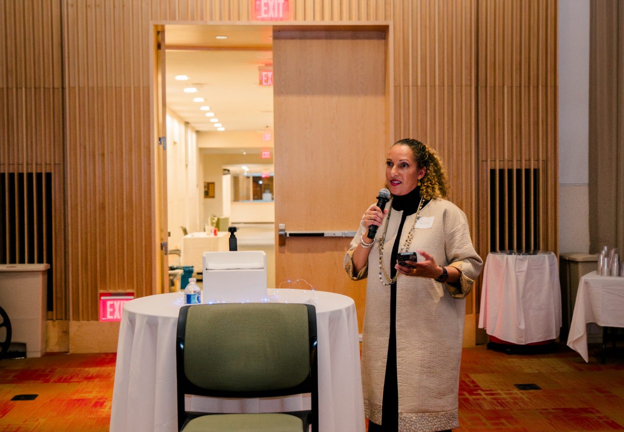 Dr. Stacey Brown holds microphone