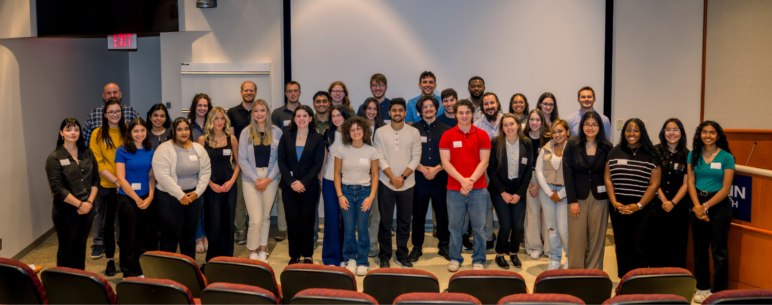 Fall 2025 class of MPH students smiling in a group photo in the low learning center